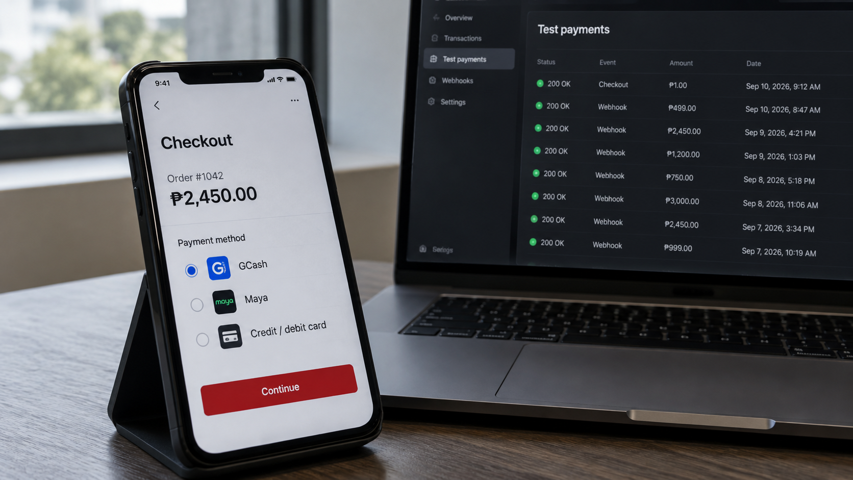 Phone checkout with e-wallet and card options beside a laptop showing payment webhook tests.