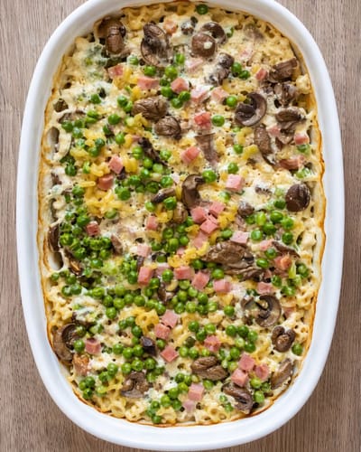 Gratin de coquillettes jambon, petits pois et comté express