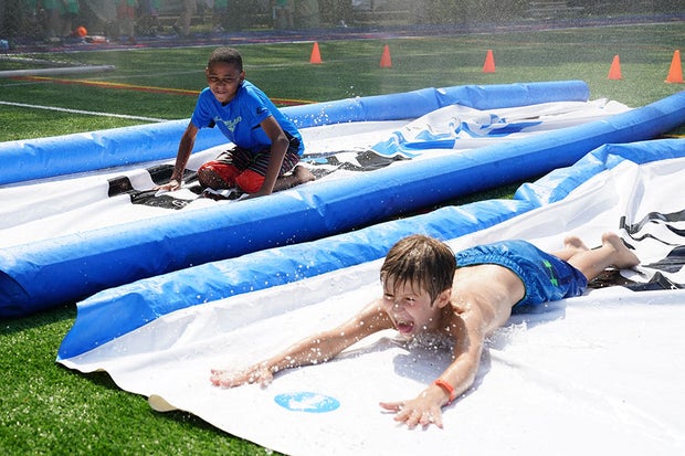 Splash Around in Asphalt Green's Sprinklers and Slip and Slides 1