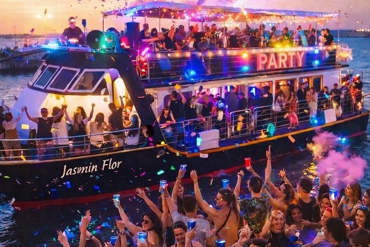 Boat party at sunset with DJ and open bar