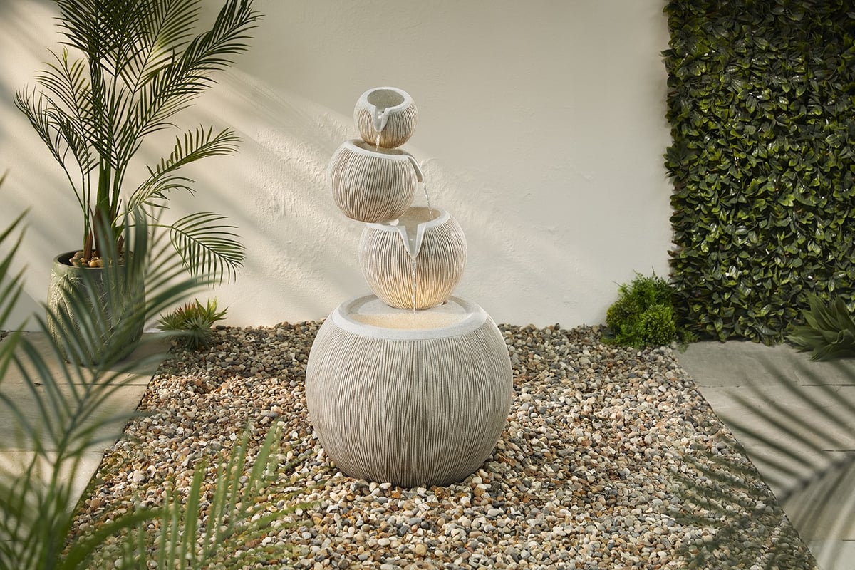 Poseidon mythological garden statue UK as a self-contained water feature with bronze finish