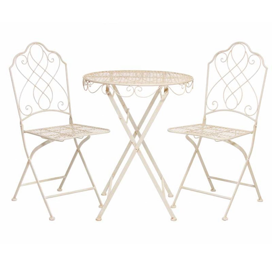 Abbotsbury antiqued cream metal bistro set with ornate cast pattern in a UK cottage garden