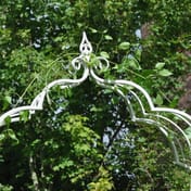 Cream Vintage Antiqued Metal Garden Arch - close-up of ornate scrollwork detail