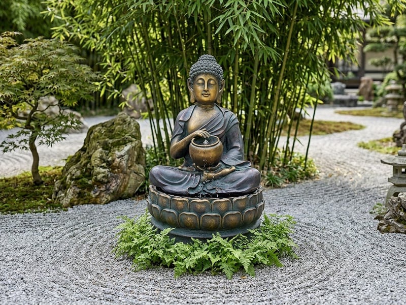 Calming Buddha solar water feature in a sunny UK garden setting