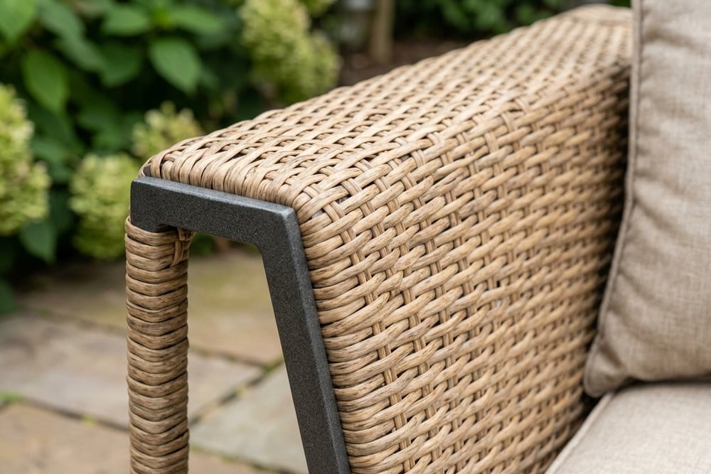 Close-up of PE rattan woven over a powder-coated metal frame