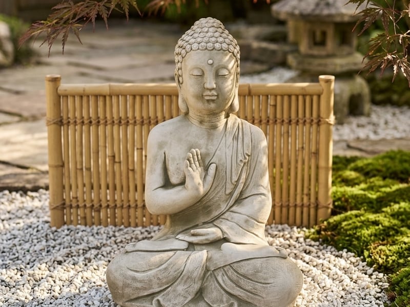 Garden ornament trends 2026 Japandi style stone Buddha Prince ornament in a minimalist UK zen garden