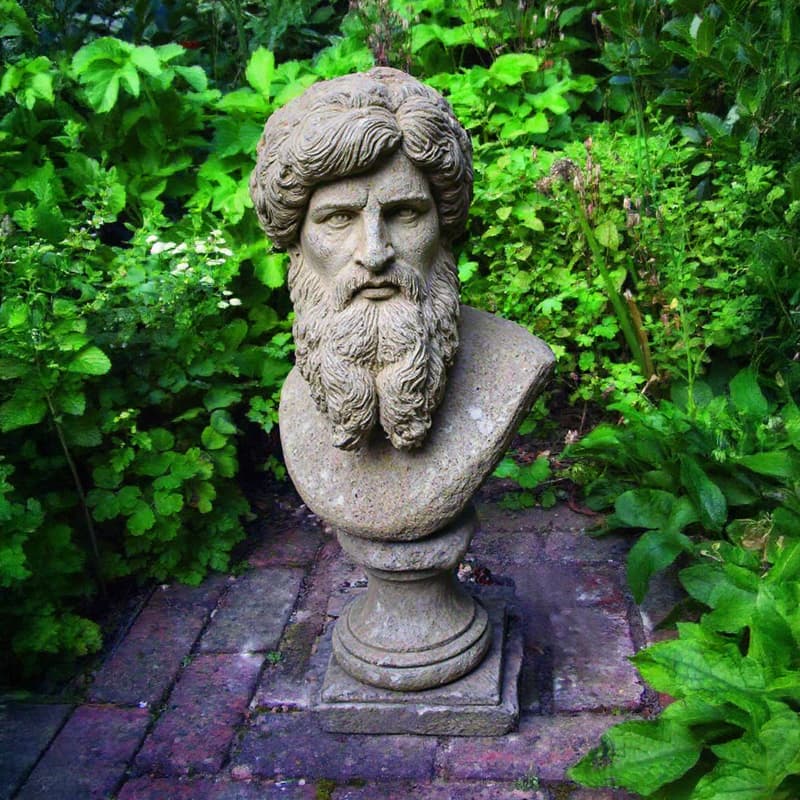 Stone Hercules bust garden ornament showing natural aged patina