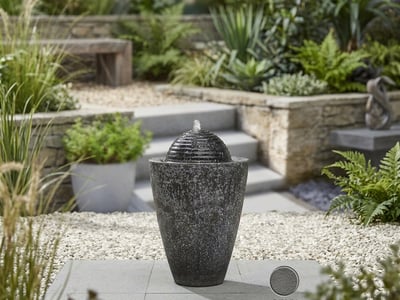 Onyx Column slim modern small water feature in a courtyard