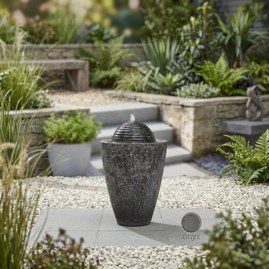 Onyx Column self-contained water feature, a black contemporary column water feature in a modern UK garden
