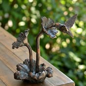 Humming Bird Tabletop Metal Garden Ornament in garden setting