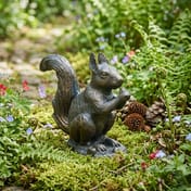 Red Squirrel Metal Garden Ornament in Garden Setting