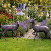 Small Stag and Doe Set Metal Garden Ornament in English Cottage Garden Setting