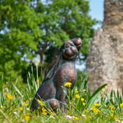 Star Gazing Hare Metal Garden Ornament in a Natural Garden Setting