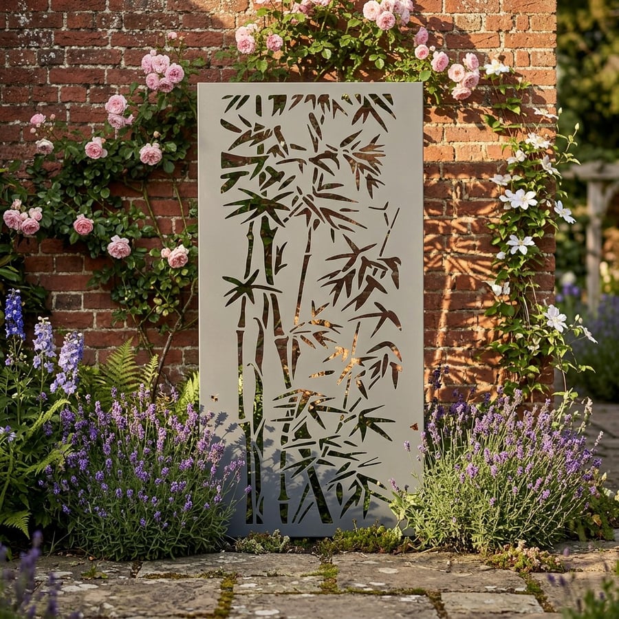 Bamboo steel decorative garden screen used as a Japanese garden boundary in a UK garden