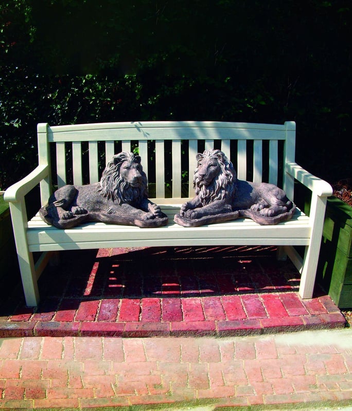 Pair of Chatsworth stone lion statues flanking a Georgian doorway