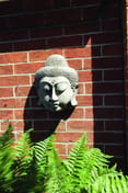 Stone Buddha Head Wall Plaque in cast stone