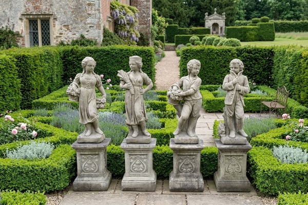 Four Seasons Garden Statues set in a formal UK lawn