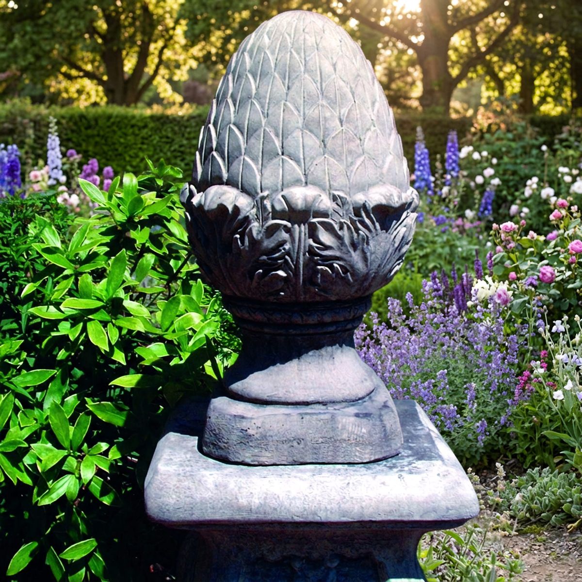 Medium Fir Cone Stone Garden Finial in a cottage garden border