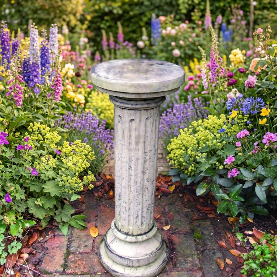 Brighton Column Stone Garden Pedestal in a UK garden showing the 1.5x plinth ratio under a classical statue