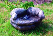 Cupped Hands Stone Fountain in cast stone
