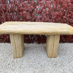 Sleeper stone garden bench in sandstone