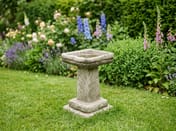 Egton Birdbath in Stone in a cottage garden setting