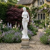Grace Garden Statue in White - Cottage Garden Setting