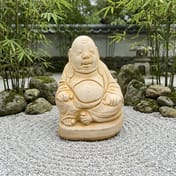 Indian Buddha Garden Ornament in Sandstone in a Zen Garden Setting