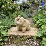 Indian Elephant Stone Garden Ornament in cottage garden setting