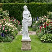 Isobelle Large Garden Statue in White in an English cottage garden setting