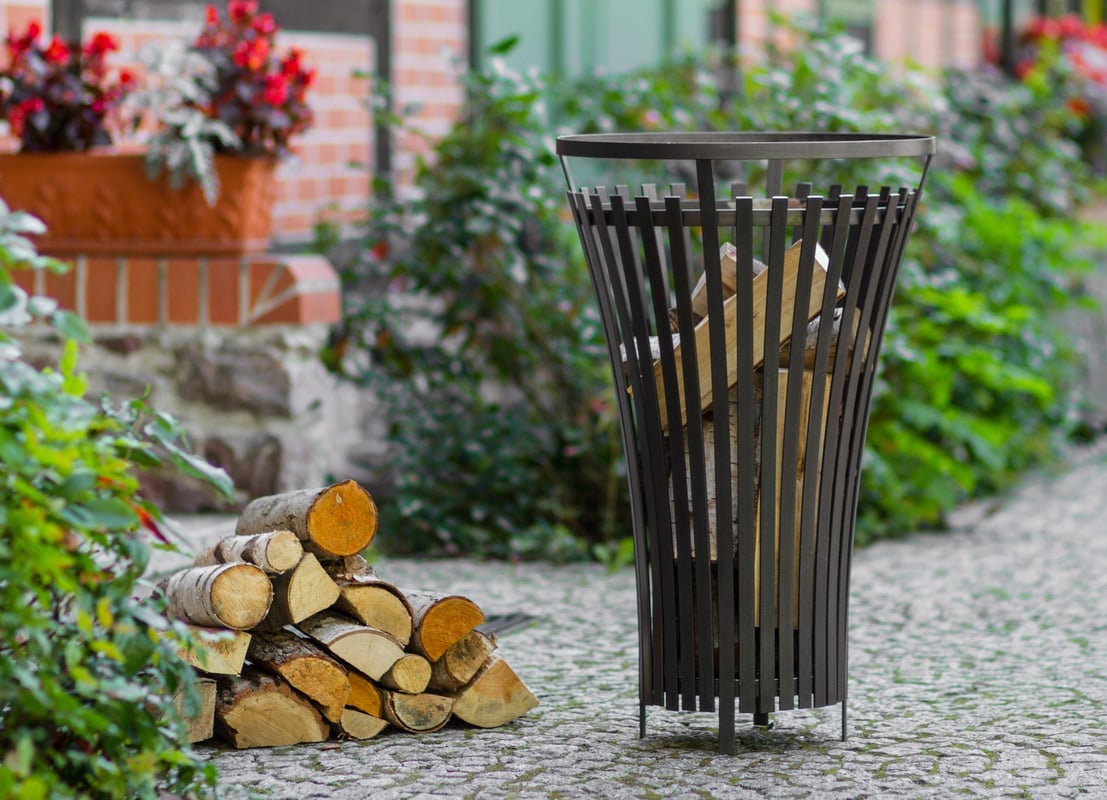 Cook King Flame 45cm compact steel fire basket on a paved courtyard in the UK