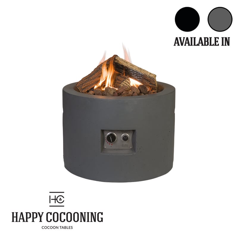 Happy Cocoon 61cm round Corten steel fire pit in grey patina finish on a UK gravel garden