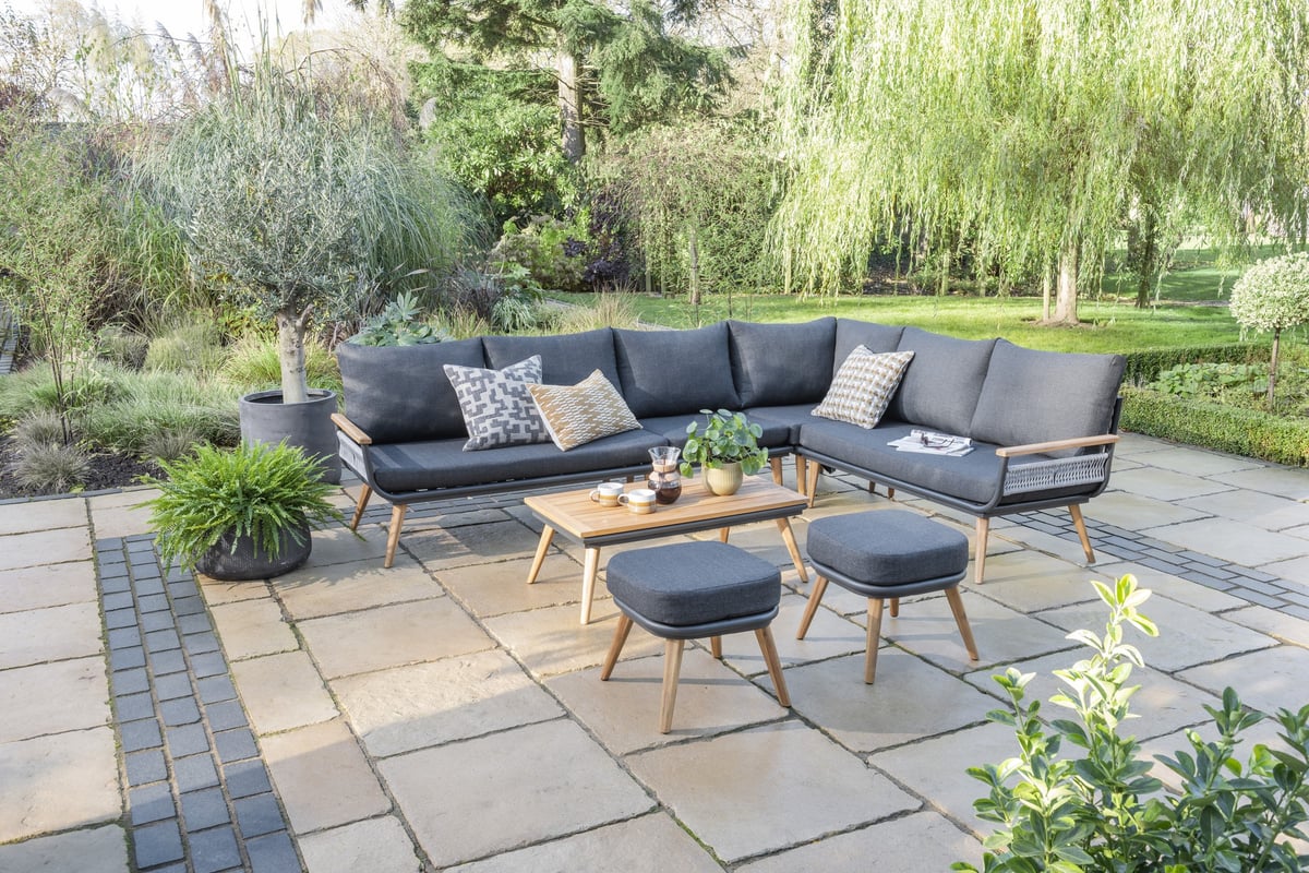 Norfolk Collection Kimora rattan corner set with grey fabric cushions on a UK patio, four-seater L-shape garden lounge configuration