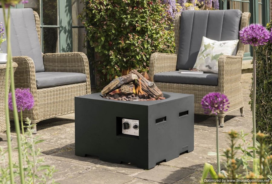 Happy Cocooning 60cm black gas fire pit with propane burner and lava rock bed in a UK courtyard