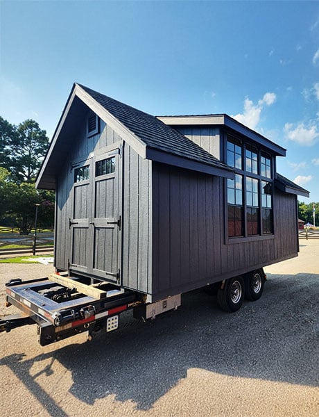 An A-frame shed on a delivery trailer for shed moving