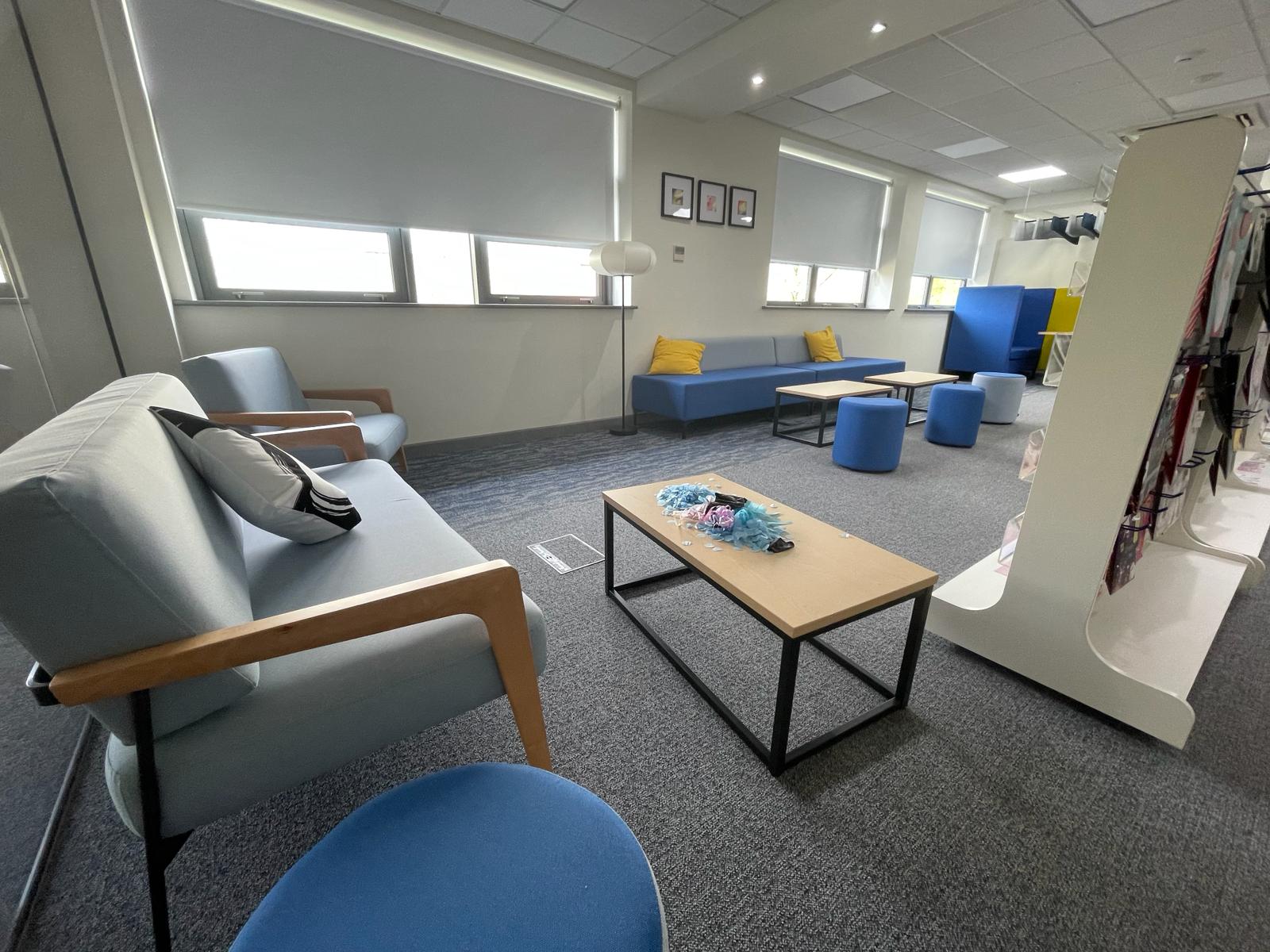 Breakout and agile working area at card factory wakefield with lounge seating, coffee tables and display stands