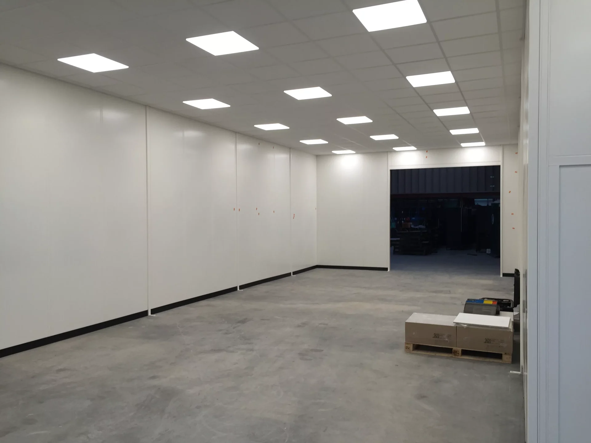 Steel partitioning installation on a warehouse floor to create a separate workspace