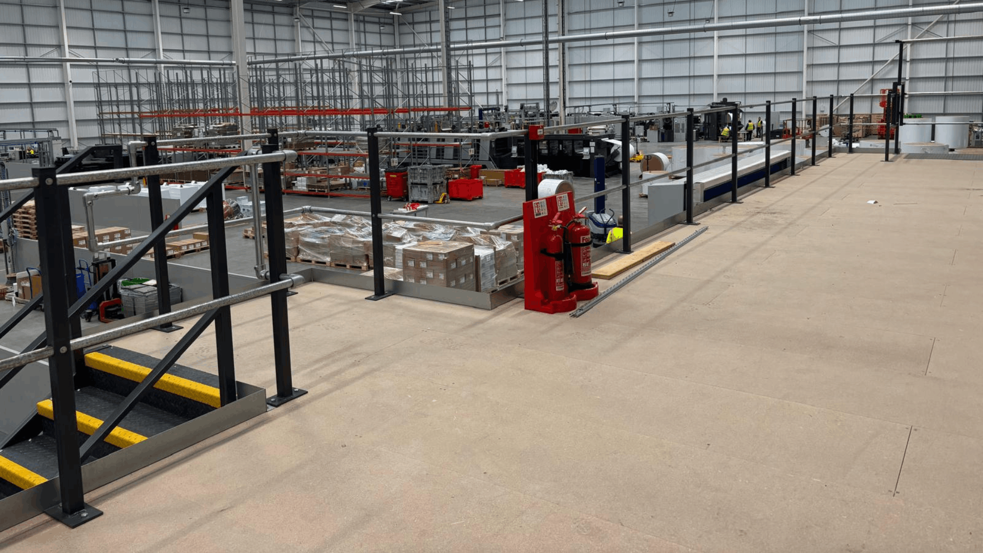 Completed mezzanine floor overlooking the smurfit westrock warehouse and production area