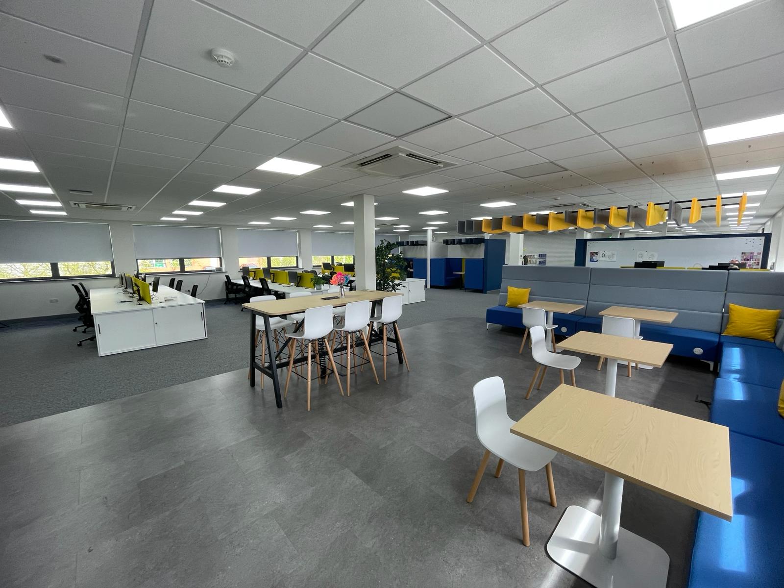 Breakout and agile working area in the card factory wakefield office refurbishment with booth seating, high tables, lvt flooring and acoustic baffles
