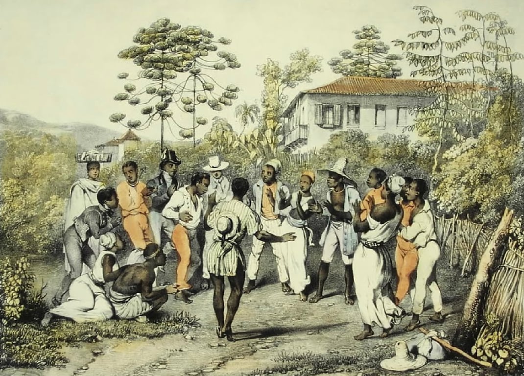 Ilustração intitulada Dança do Batuque, de Johann Moritz Rugendas. A cena mostra um grupo de homens, mulheres e crianças negras reunidos em uma área aberta, diante de uma casa de fazenda cercada por árvores. No centro, um casal dança enquanto é observado pelos demais participantes, dispostos em roda. À direita, homens tocam tambores e outros instrumentos, acompanhando a dança, enquanto algumas pessoas batem palmas e cantam. À esquerda, duas pessoas estão sentadas no chão e outras acompanham a celebração de pé. Os participantes vestem roupas claras, chapéus e tecidos coloridos em tons de branco, bege e alaranjado. Ao fundo, aparecem árvores de grande porte, vegetação e uma construção colonial de dois andares. A imagem retrata uma roda de batuque, manifestação cultural de origem africana preservada e praticada pela população negra no Brasil durante o século XIX.