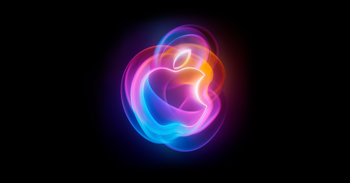 Logo de Apple iluminado en un escenario oscuro
