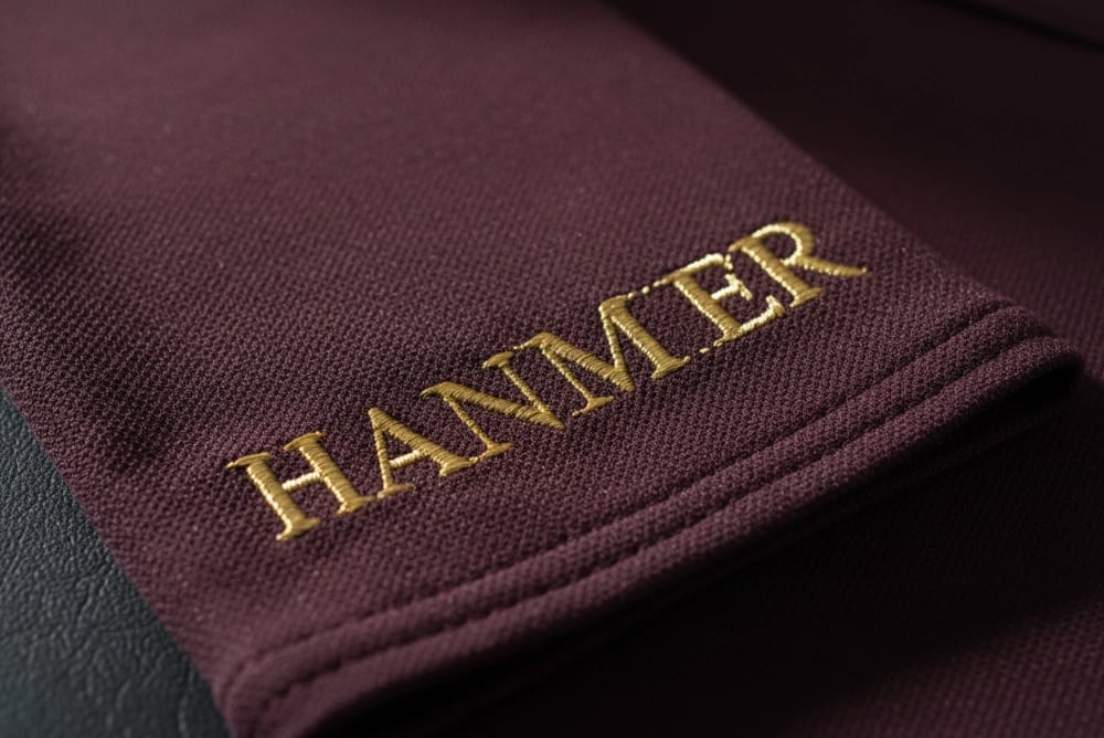 Sleeve cuff name embroidery on equestrian club apparel