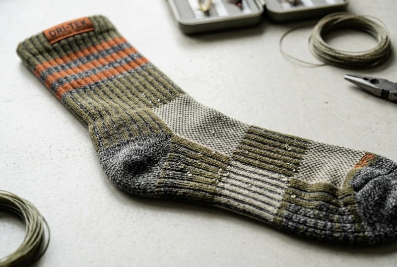 Moisture-wicking channel knit technology for dry feet