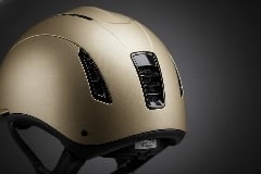 Low-friction Teflon coating on helmet rear for reduced neck injury during falls