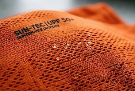 Orange fishing apparel material