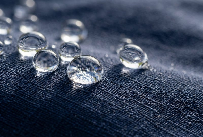 DWR Durable Water Repellent C6 Coating - Water Droplets Beading on Fabric