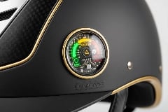 Impact indicator chip showing helmet safety status with color-coded warning system
