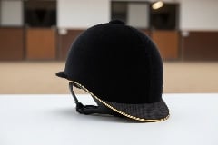 Extended rear protection on custom riding helmet covering C1 vertebra