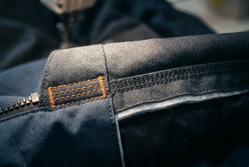 Reinforced Critical Zone Stitching for Durable Ice Fishing Clothing