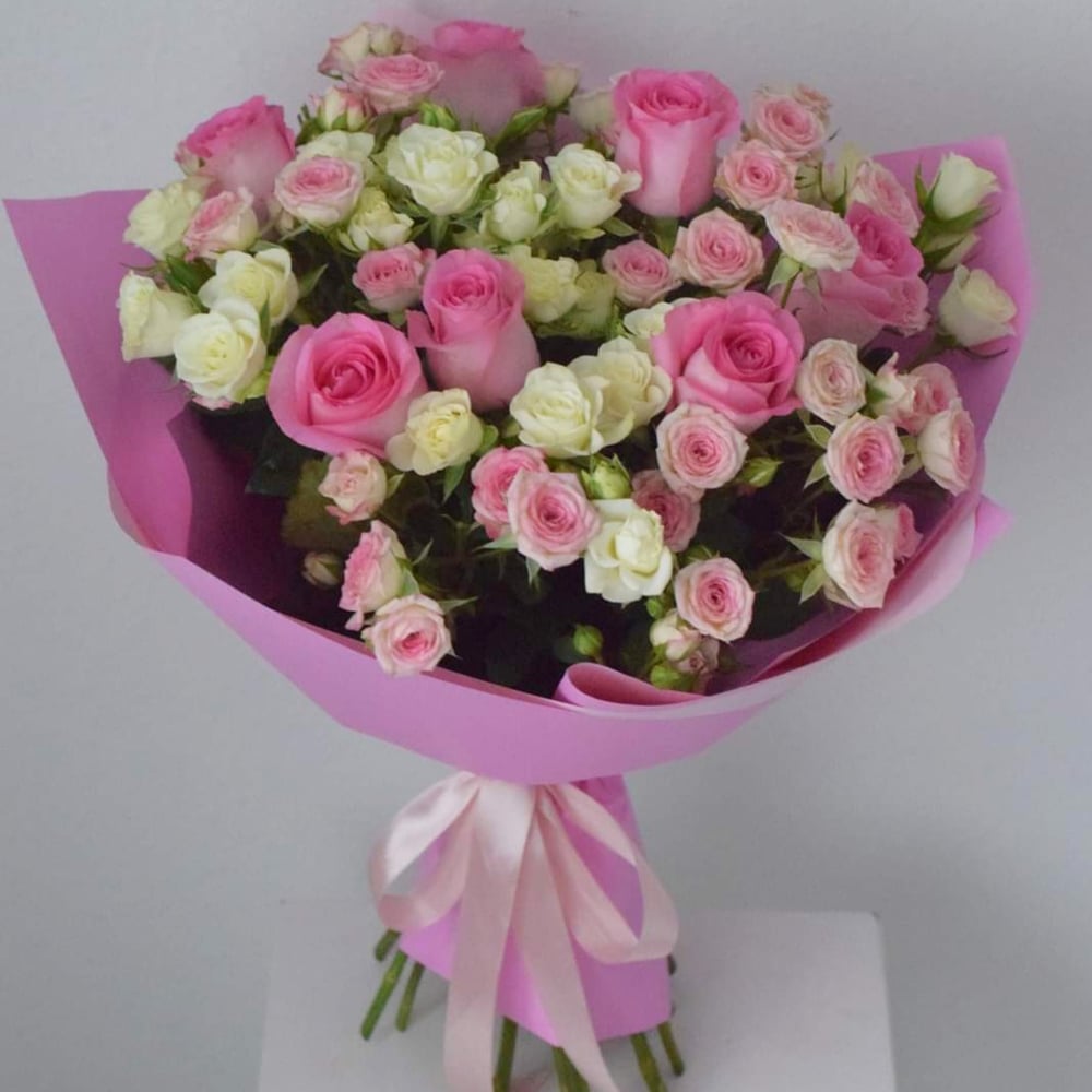 Premium Photo  Beautiful delicate pink flower bouquet of white roses and  eustoma in a beautiful package